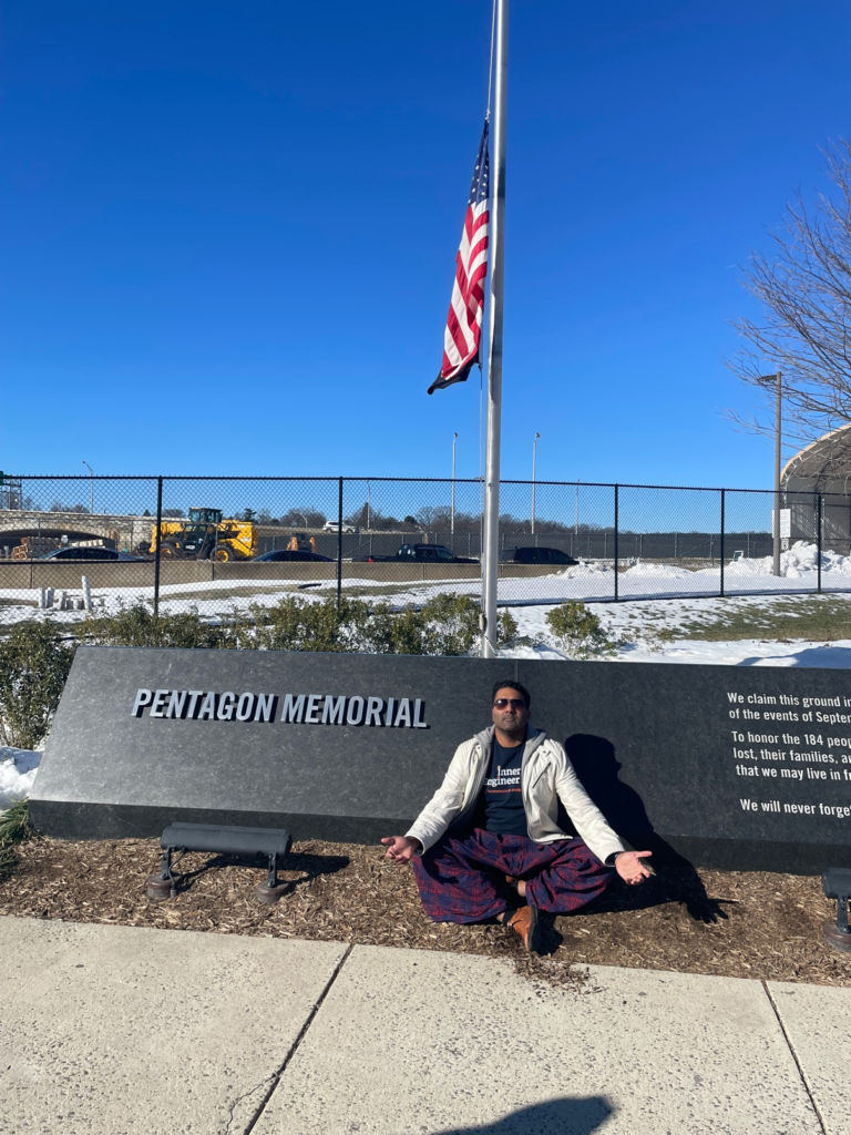 Karthik meditating in front of the Pentagon Memorial